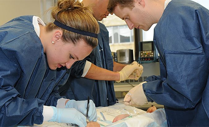 Physician Assistant Students practicing clinical exercises.