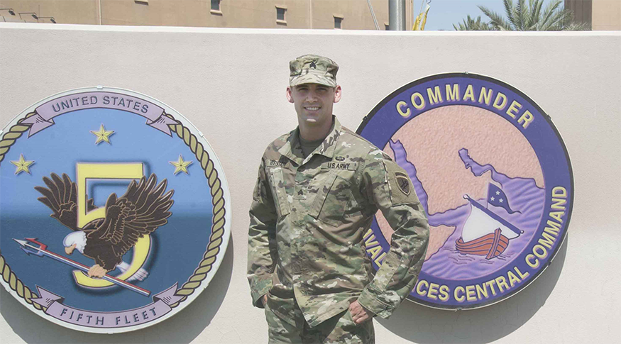 Christopher Weston standing in front of a Commander sign